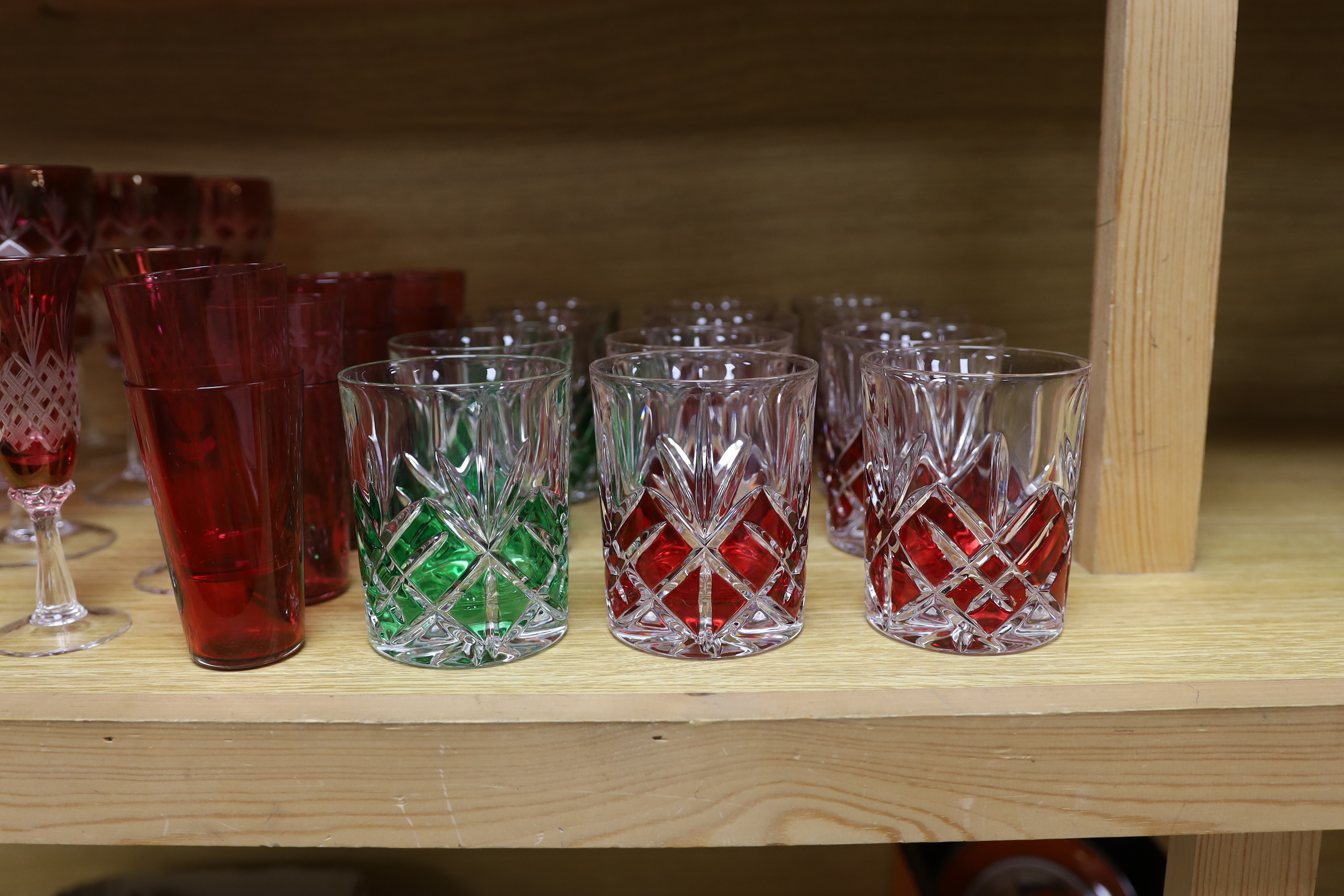A set of ruby and green flashed glasses, tallest 18cm